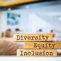 ImageofofficeandDiveristyEquityandInclusionwrittenonblocksinforeground