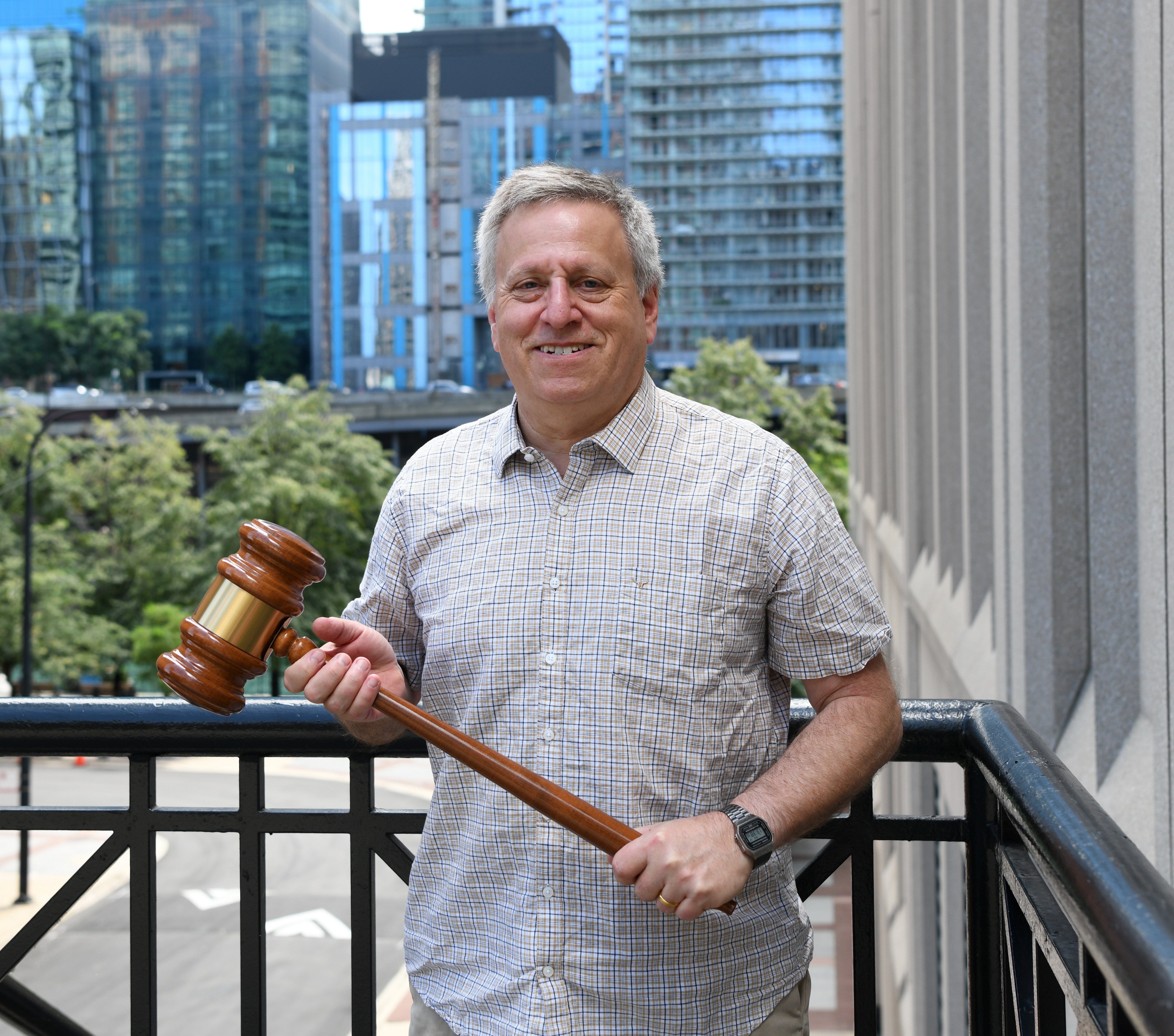 Image of Peter Bamberger holding AOM gavel