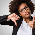Imageofwomanholdingthumbsupandthumbsdown