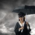 graduate-holding-umbrella