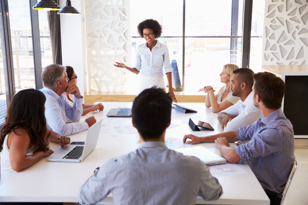 woman-talks-at-meeting